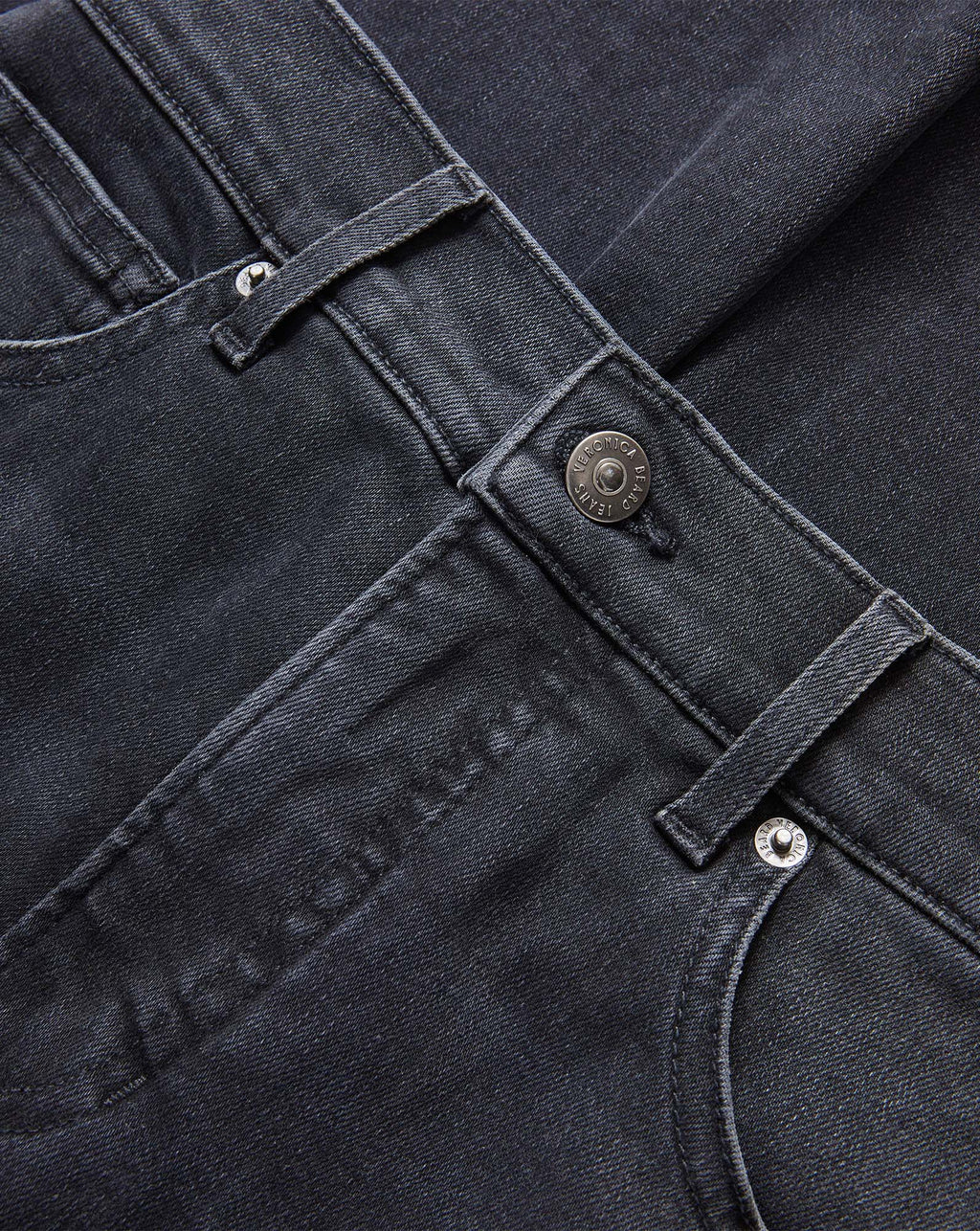 Veronica Beard Black denim jeans with silver button closure.