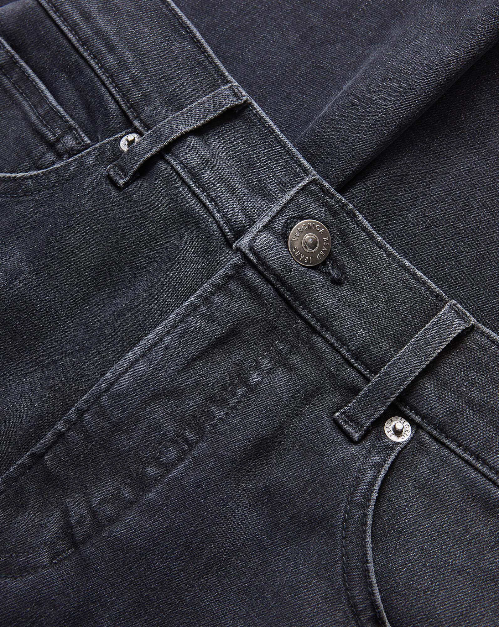 Veronica Beard Black denim jeans with silver button closure.