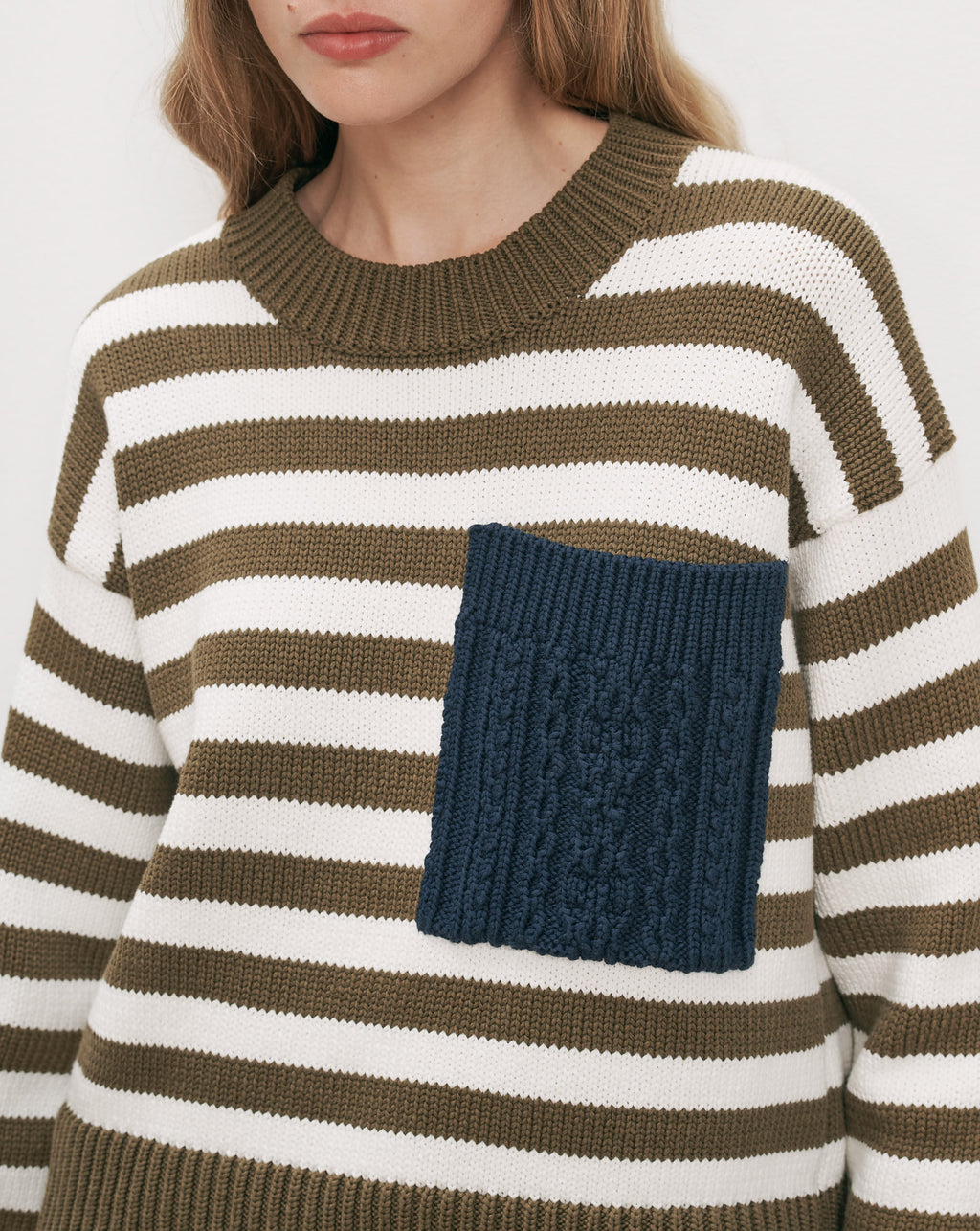 Veronica Beard Striped knit sweater with blue cable-knit pocket.