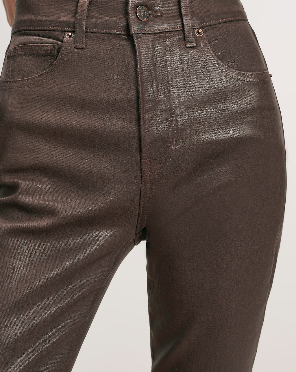 Veronica Beard Brown coated denim jeans with five pockets.