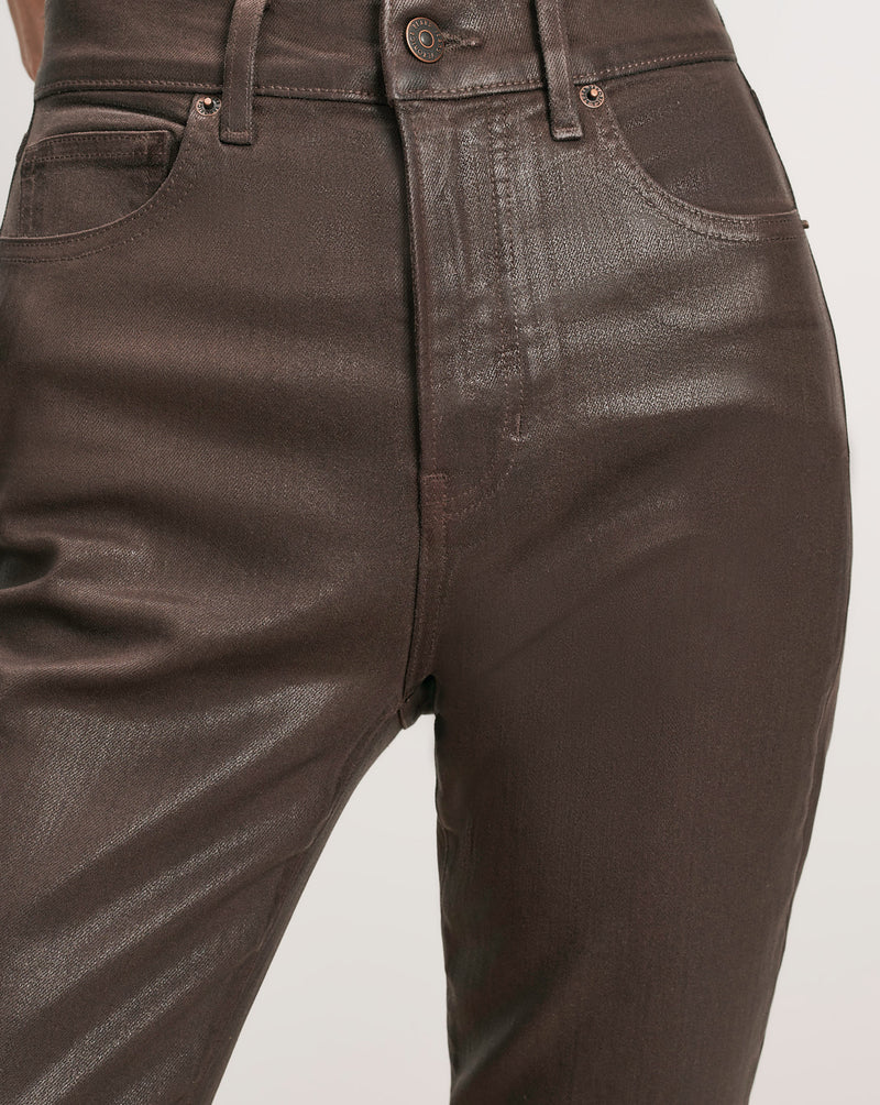 Veronica Beard Brown coated denim jeans with five pockets.