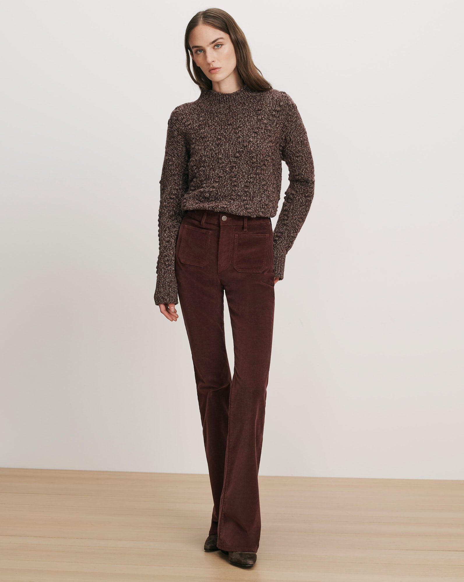 Veronica Beard Brown marled knit sweater and brown corduroy flare pants.