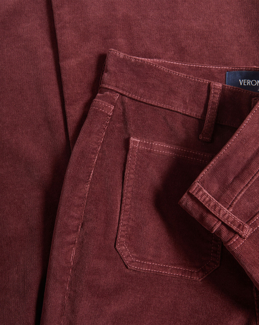 Veronica Beard Burgundy corduroy trousers with a back pocket.