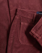 Veronica Beard Burgundy corduroy trousers with a back pocket.