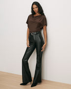 Veronica Beard Brown cowl-neck top and black leather flare pants.