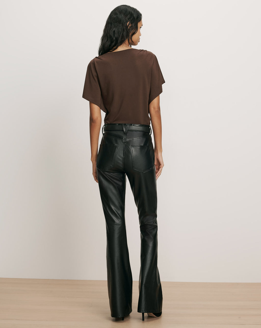 Veronica Beard Brown t-shirt and black faux leather pants.