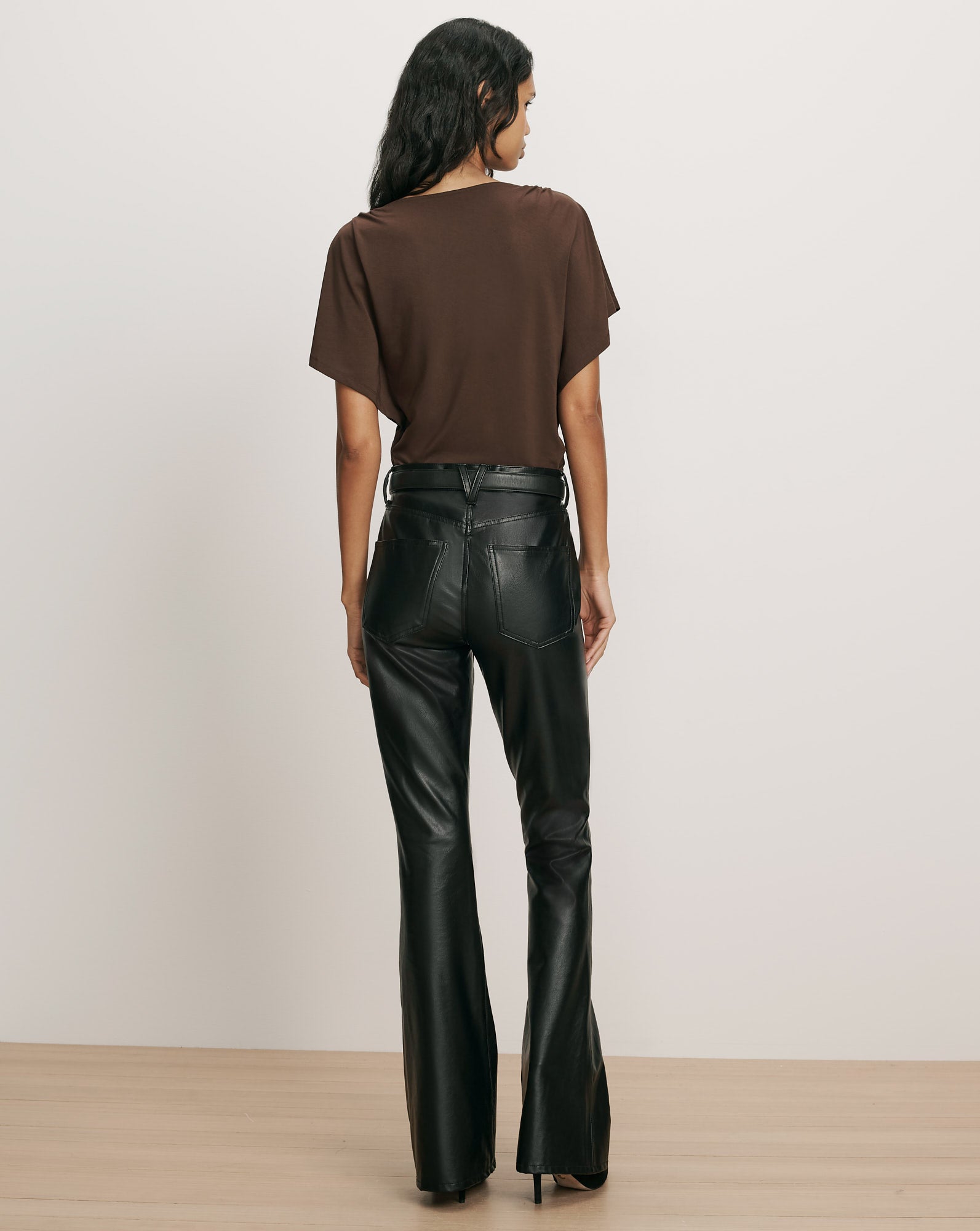 Veronica Beard Brown t-shirt and black faux leather pants.