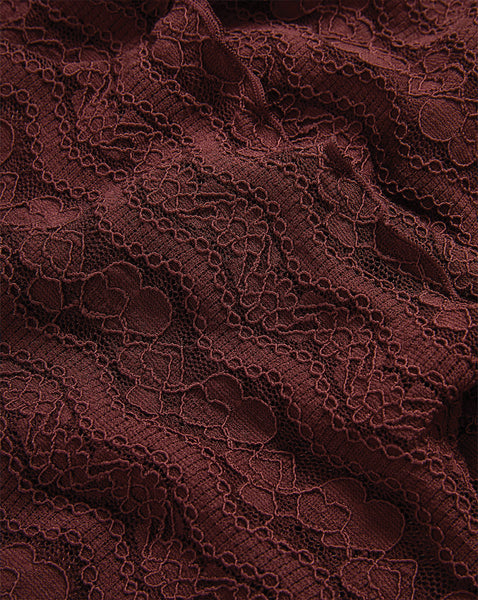 Veronica Beard Burgundy lace fabric with intricate floral embroidery.