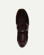 Veronica Beard Burgundy velvet sneaker with dark leather stripes.