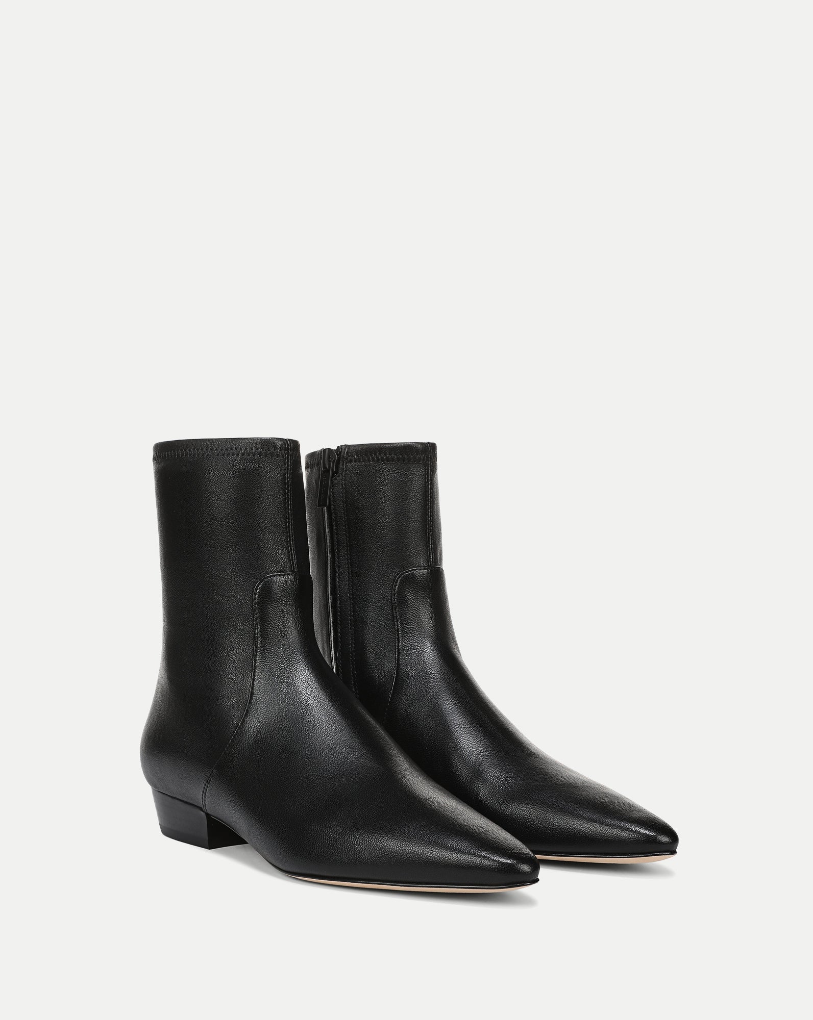 Veronica Beard Black leather ankle boots with pointed toes.