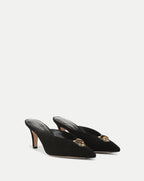 Veronica Beard Black suede mules with gold and amber embellishment.