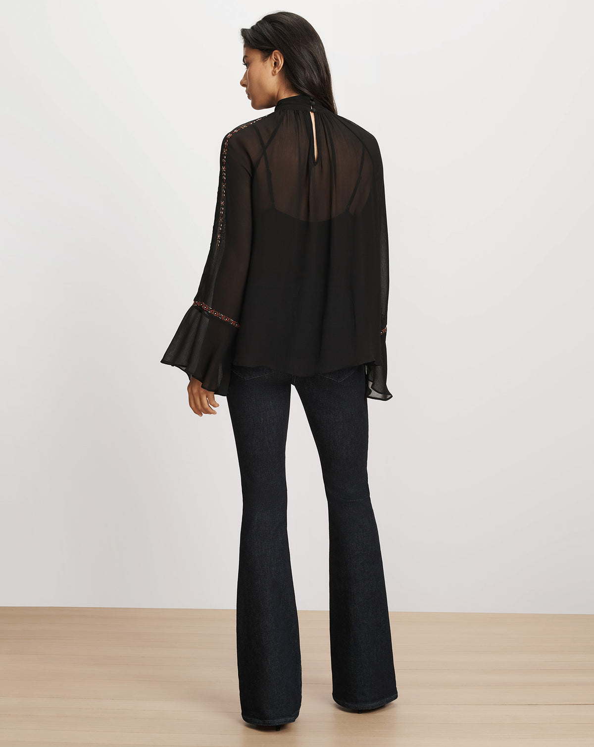 Veronica Beard Black chiffon blouse with flared sleeves and trim.