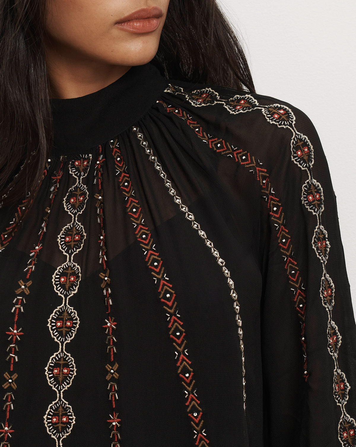 Veronica Beard Black embroidered mock neck blouse.