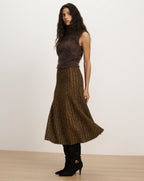 Veronica Beard Brown fuzzy sleeveless turtleneck sweater and patterned midi skirt.