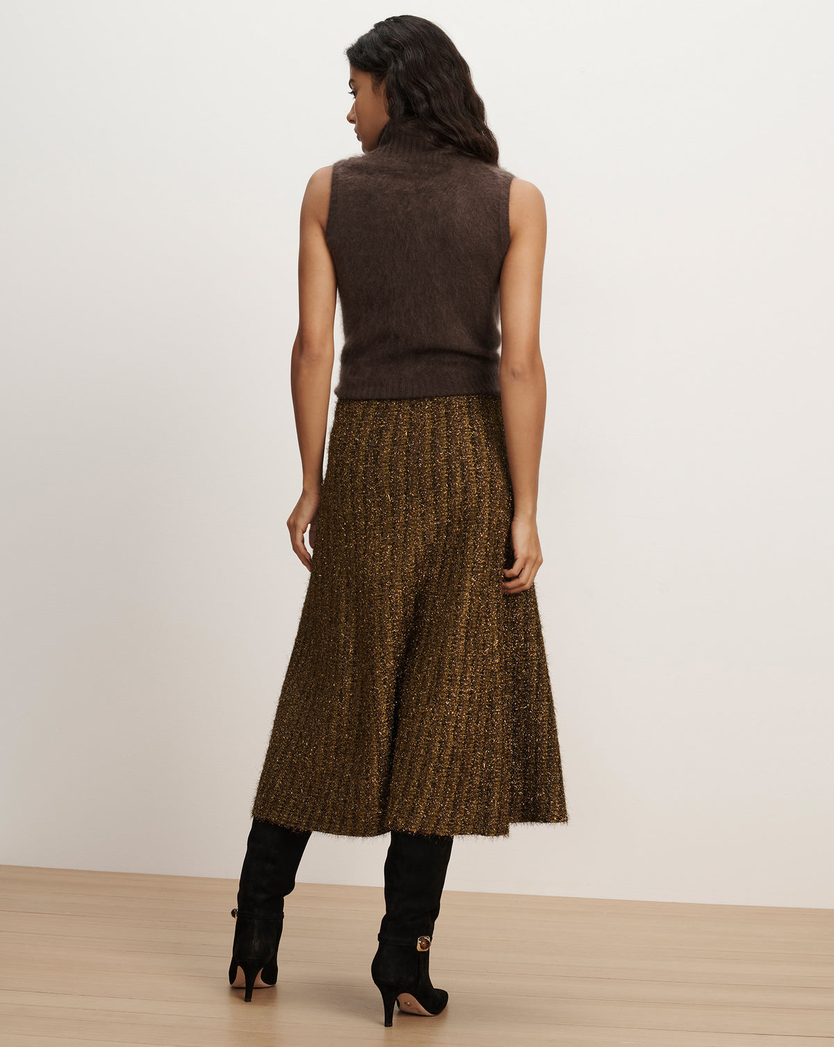 Veronica Beard Brown sleeveless knit top and metallic pleated skirt.