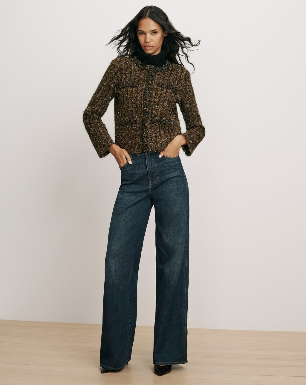 Veronica Beard Brown tweed jacket and blue denim jeans.