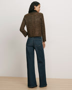 Veronica Beard Brown tweed jacket and blue denim jeans.