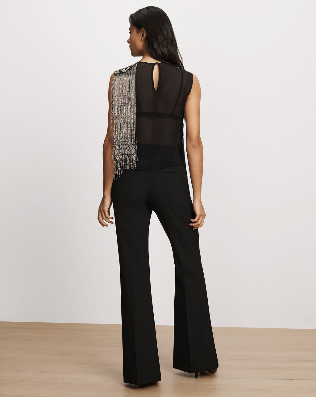 Veronica Beard Black sleeveless top with crystal fringe and trousers.