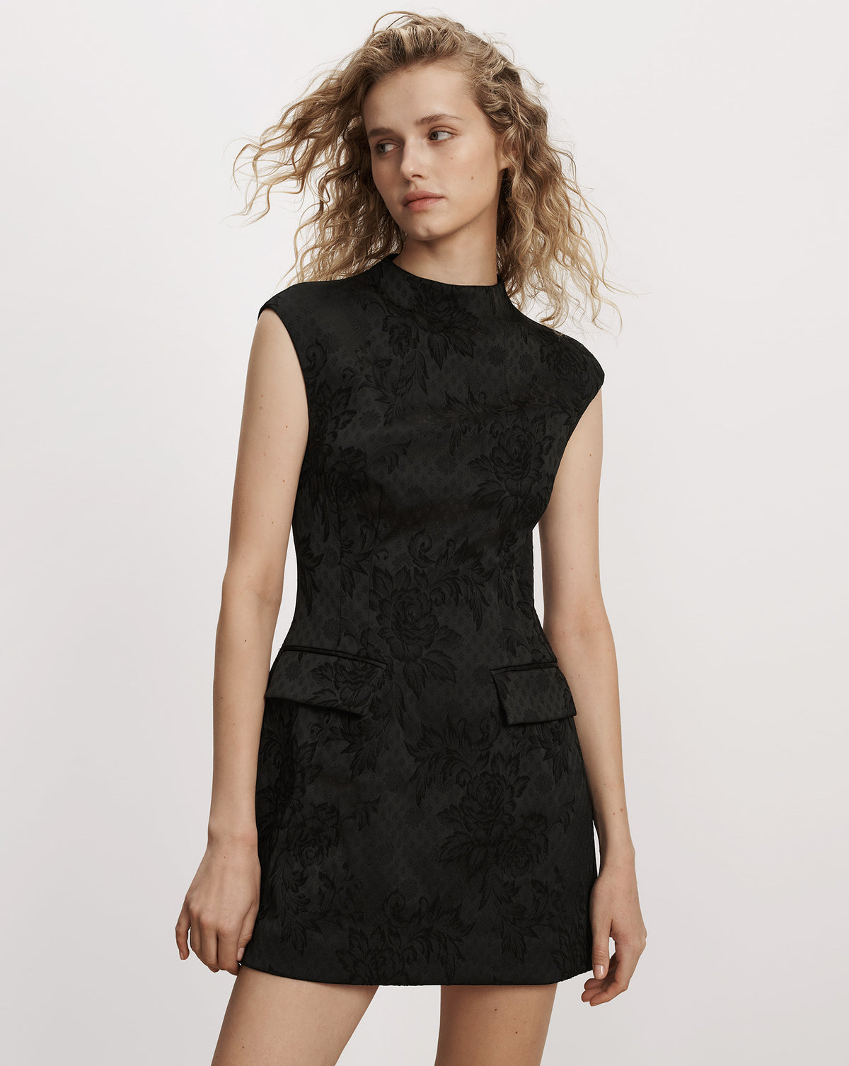Veronica Beard Black floral brocade sleeveless mock neck minidress.