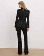 Veronica Beard Black floral brocade blazer and black trousers.