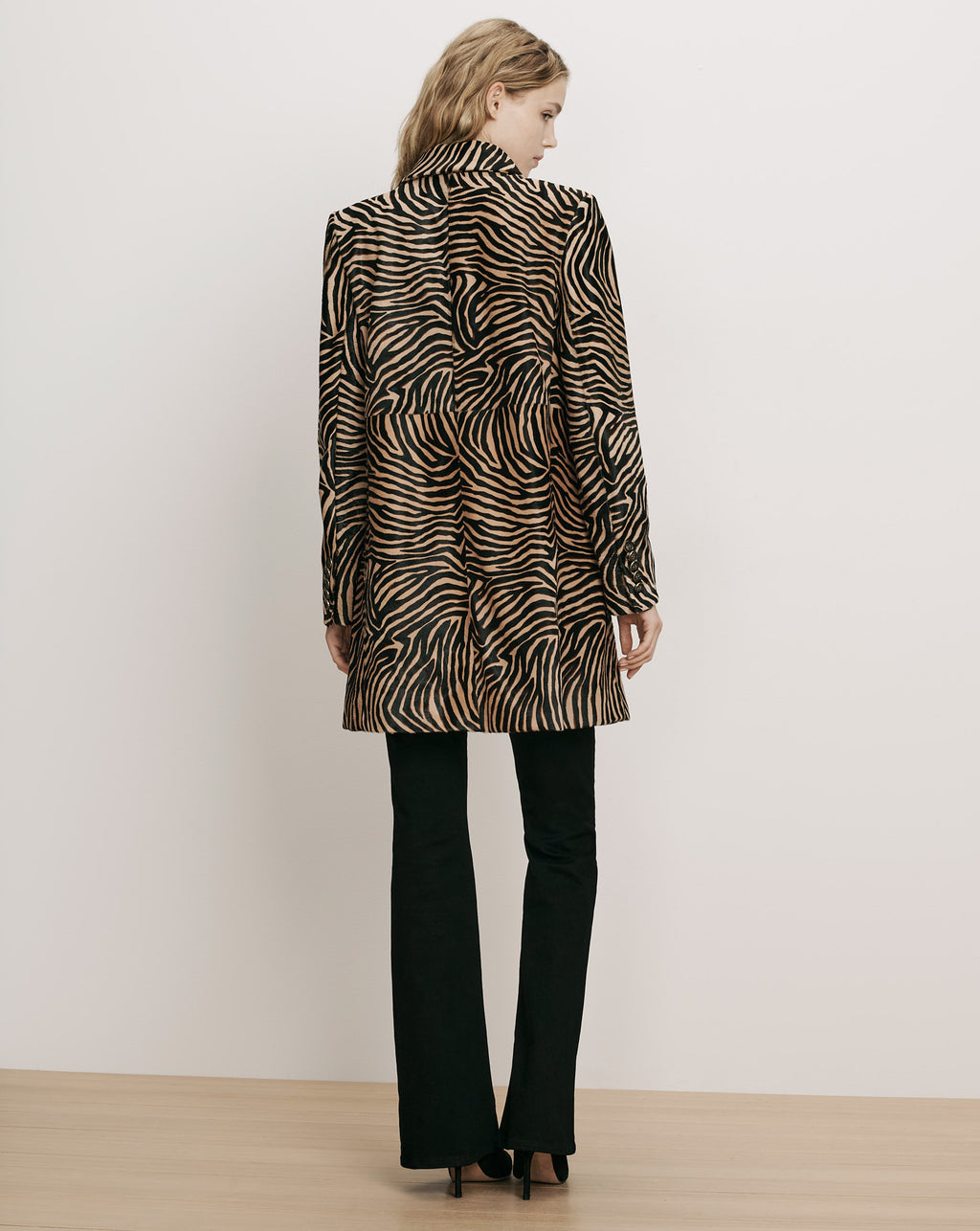 Veronica Beard Brown zebra print patterned jacket, black trousers.