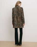 Veronica Beard Brown zebra print patterned jacket, black trousers.