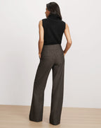 Veronica Beard Brown wide-leg tweed trousers and black sweater.