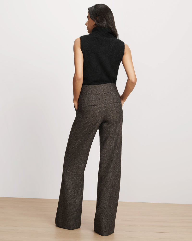 Veronica Beard Brown wide-leg tweed trousers and black sweater.