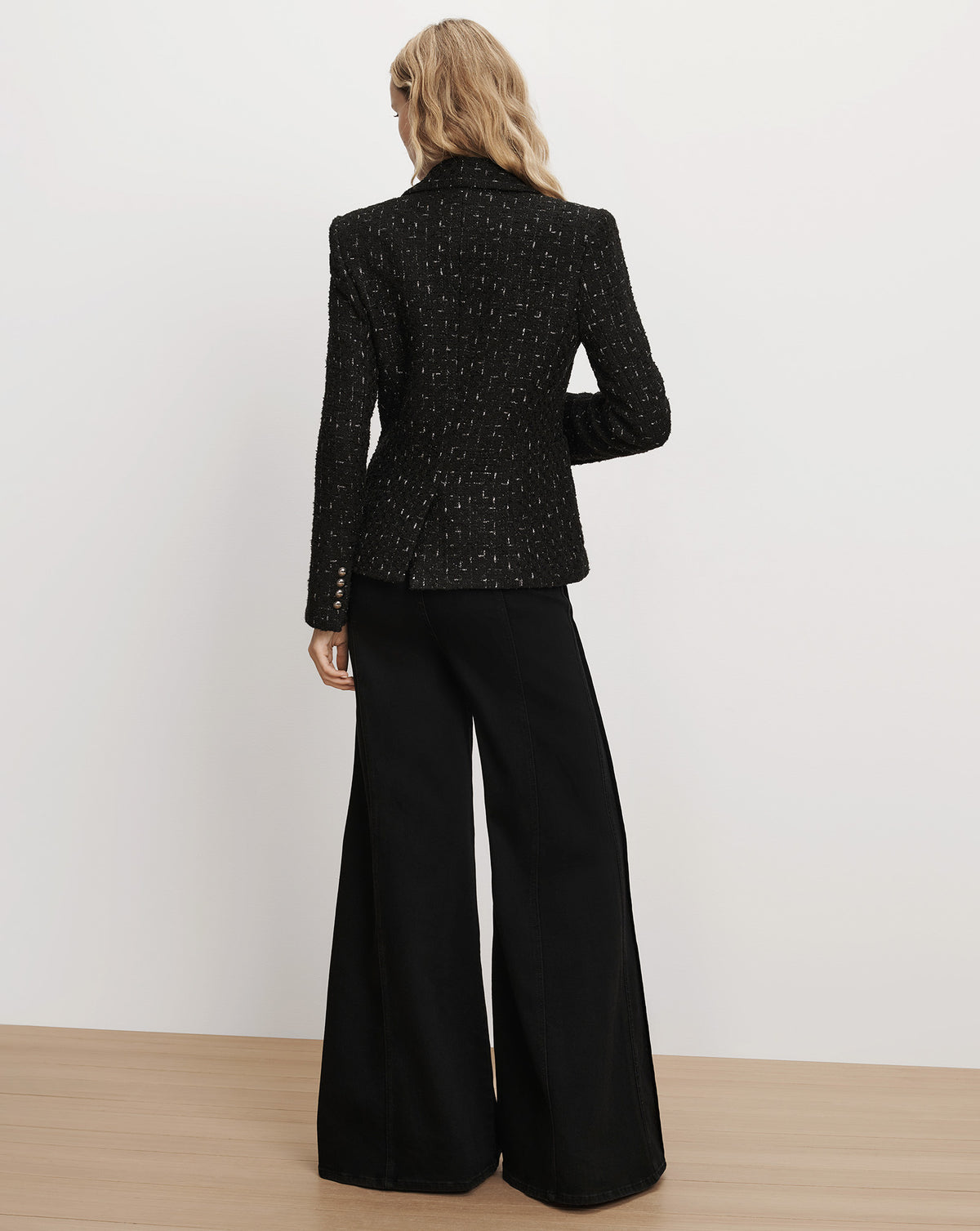 Veronica Beard Black textured tweed blazer and wide-leg trousers.