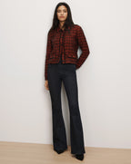 Veronica Beard Red tweed jacket and dark flare jeans.