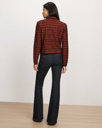 Veronica Beard Red tweed blazer and dark denim flare jeans.