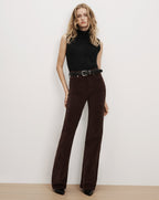 Veronica Beard Black sleeveless turtleneck and brown corduroy pants.