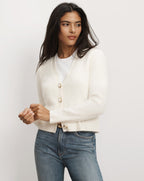 Veronica Beard White button-down cashmere cardigan with gold buttons.