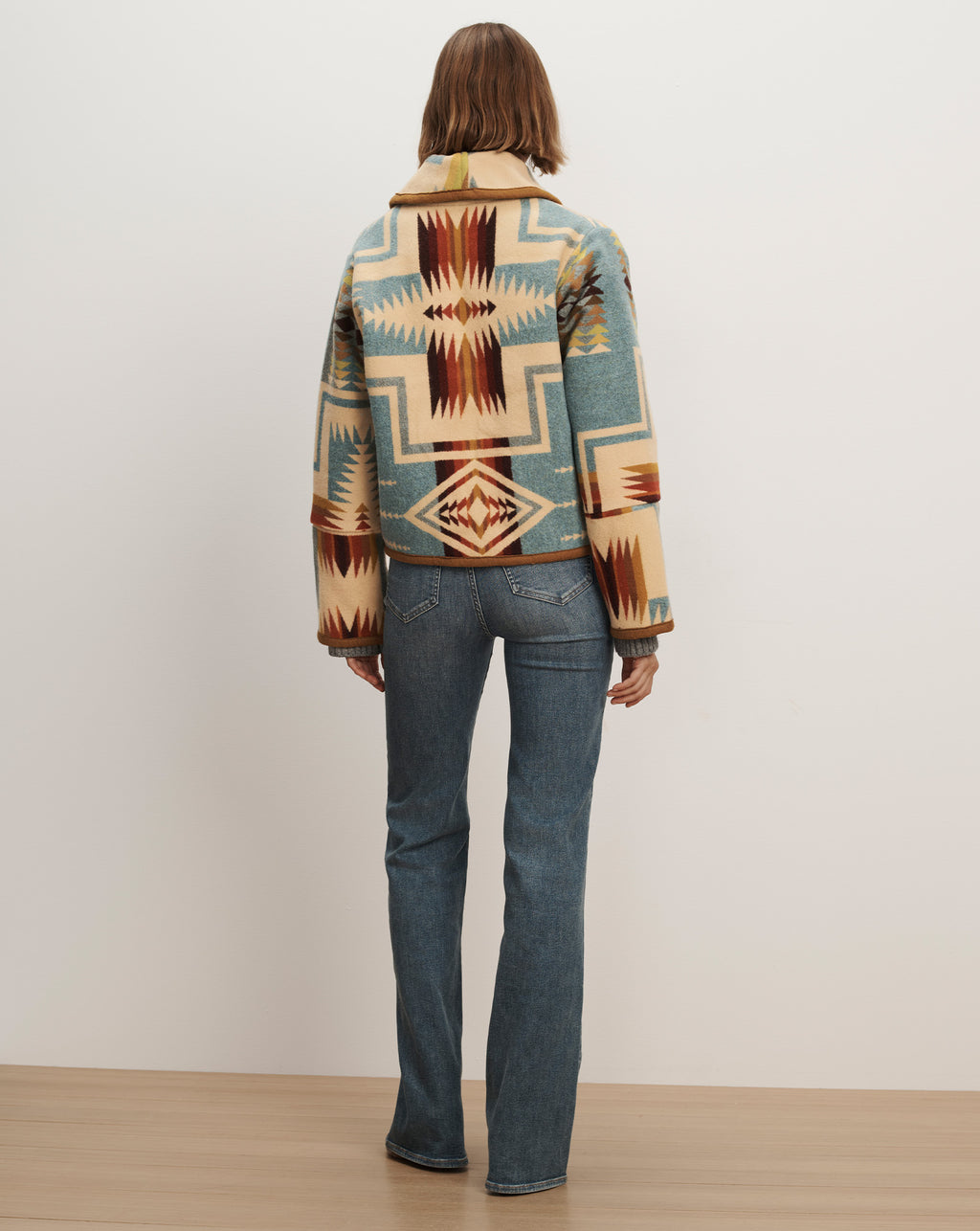 Veronica Beard Multicolor patterned wool crop jacket and blue jeans.