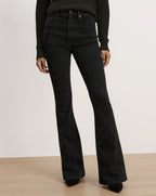Veronica Beard Black flare jeans with embroidered floral pattern.