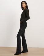 Veronica Beard Dark grey flared jeans with subtle pattern.