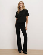 Veronica Beard Black t-shirt and flared black jeans.
