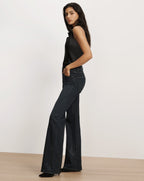 Veronica Beard Black sleeveless top and embellished flare jeans.