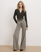 Veronica Beard Grey wide-leg denim jeans and black henley top.
