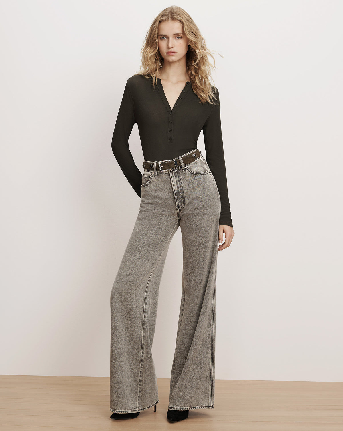 Veronica Beard Grey wide-leg denim jeans and black henley top.