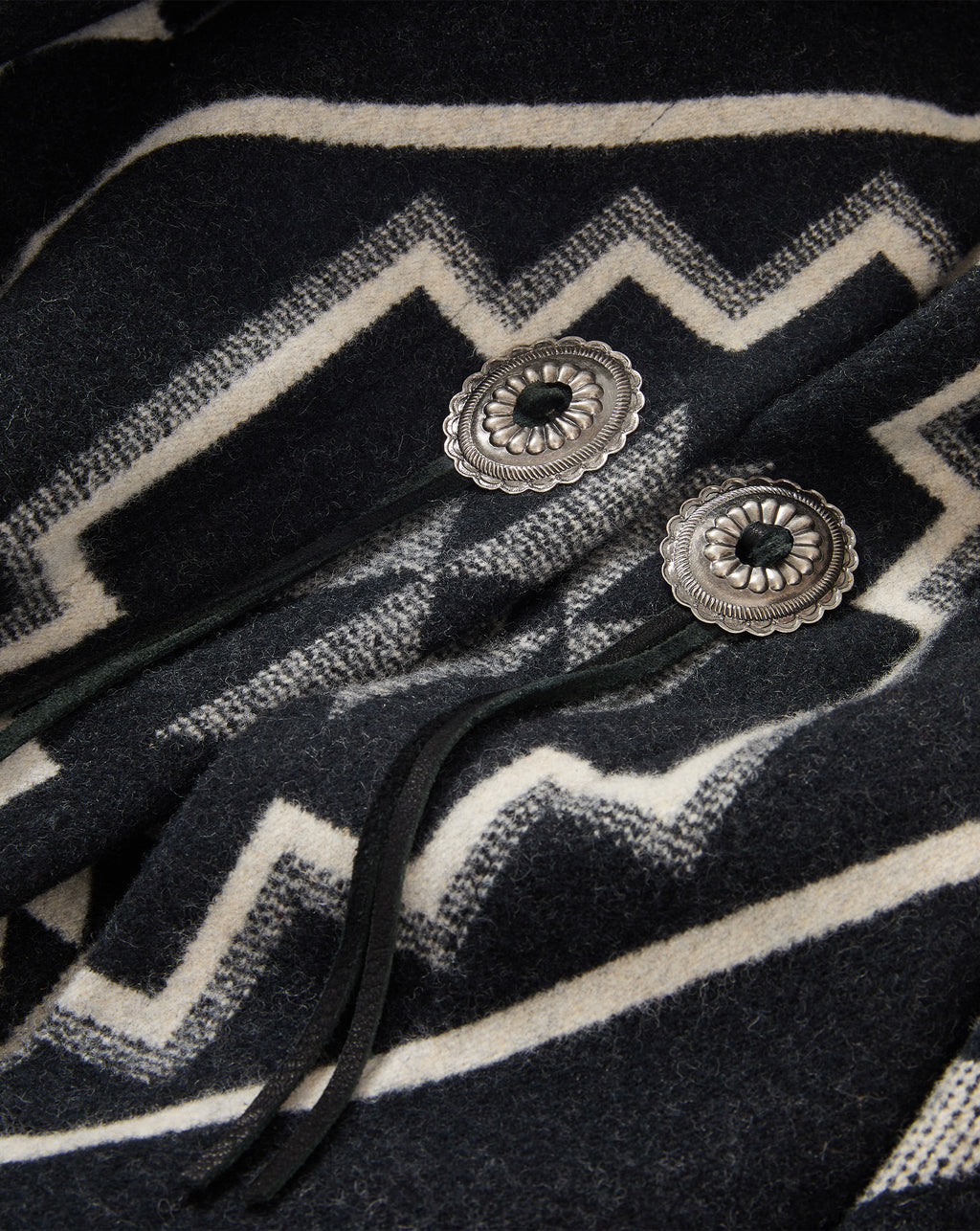 Veronica Beard Black and white patterned wool wrap with concho buttons.