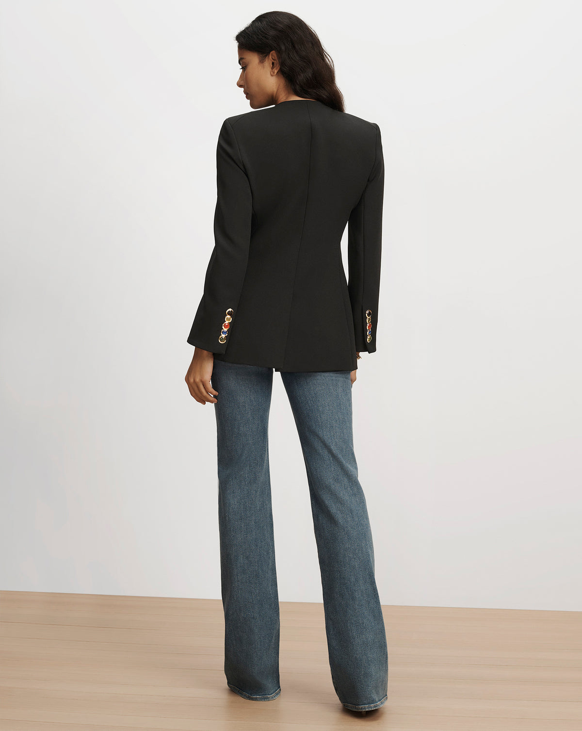 Veronica Beard Black tailored blazer with decorative sleeve buttons.