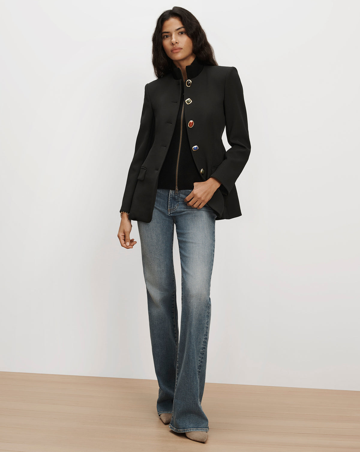 Veronica Beard Black tailored structured jacket with decorative buttons.