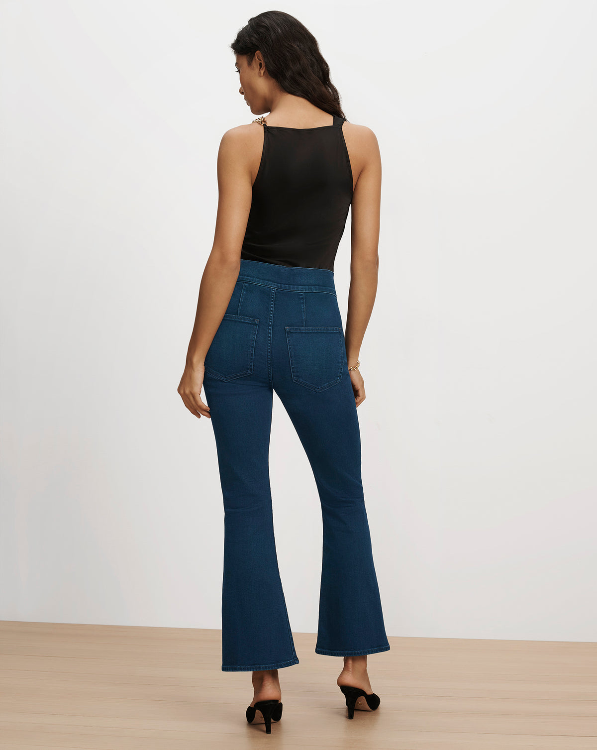 Veronica Beard Blue denim flared jeans and black tank top.