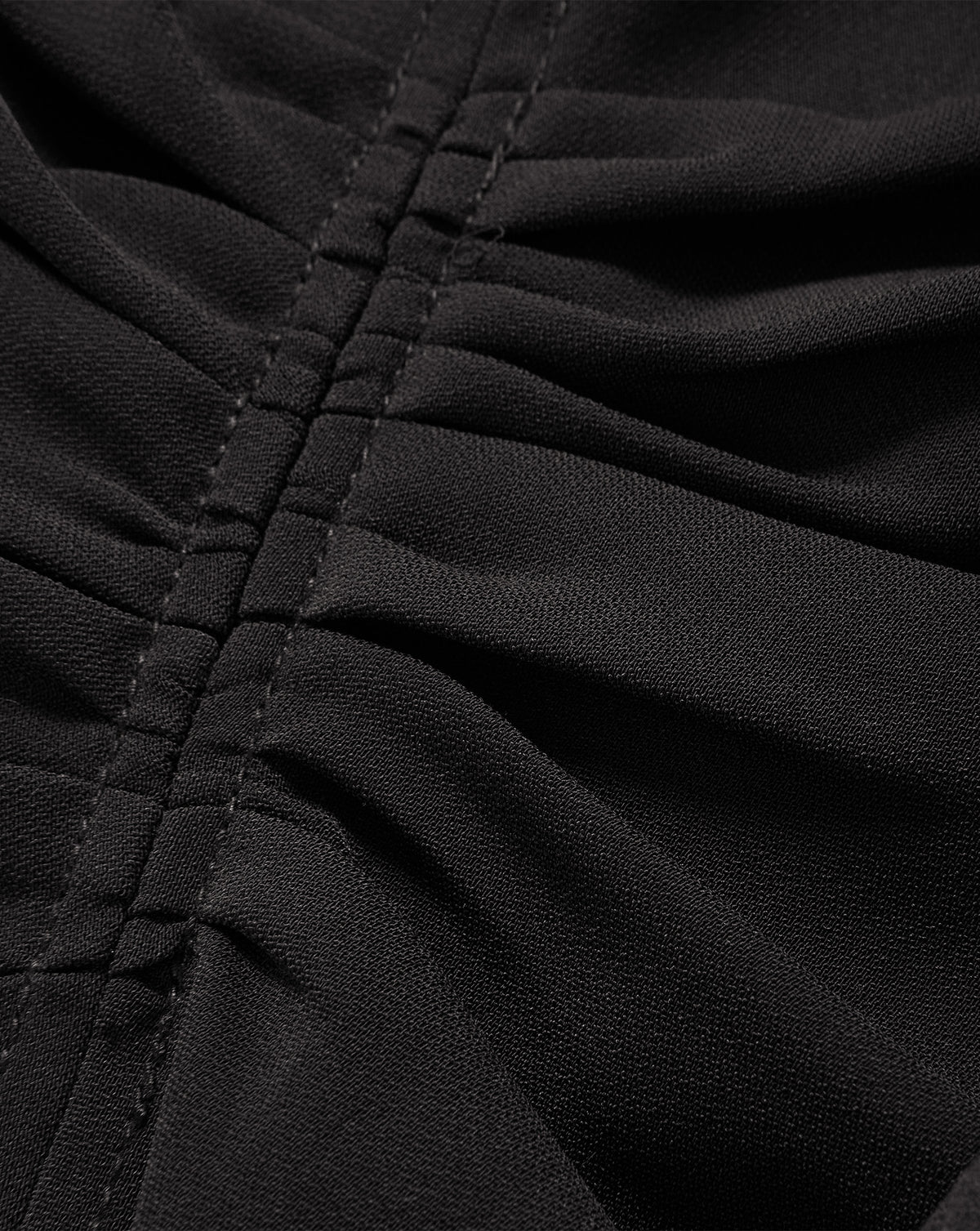 Veronica Beard Black ruched fabric with central gathered seam.