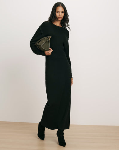 Veronica Beard Black knit midi dress with long sleeves.