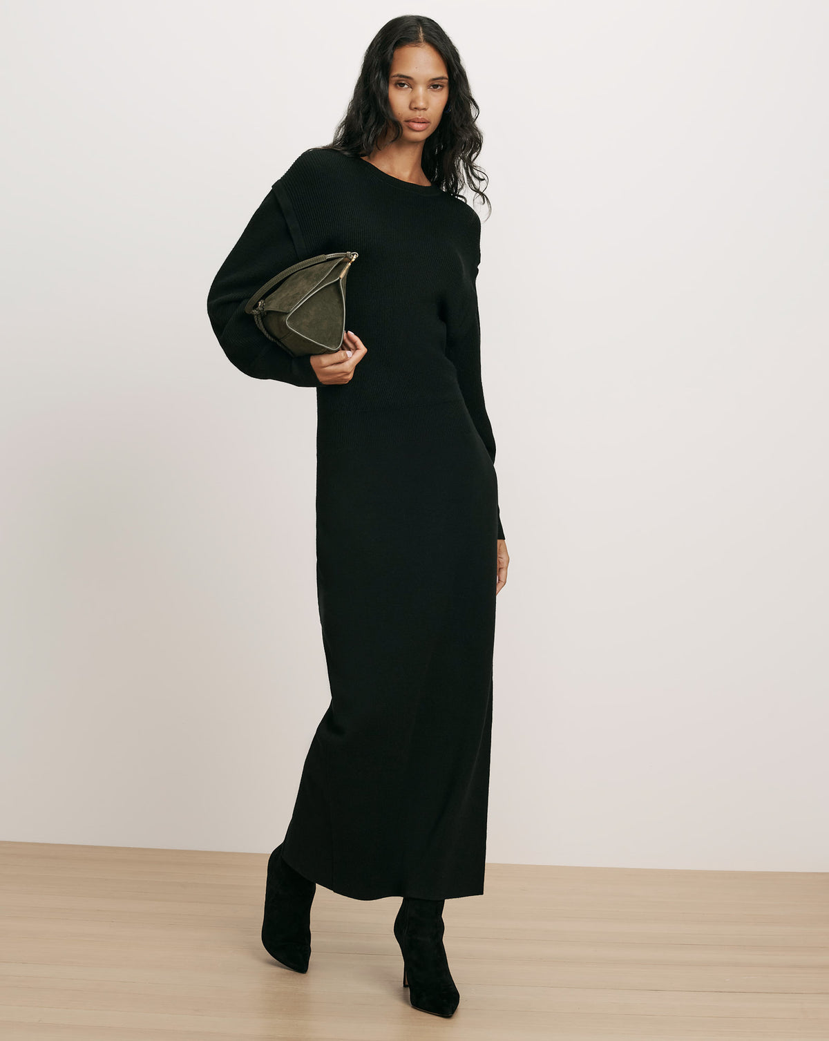 Veronica Beard Black knit midi dress with long sleeves.