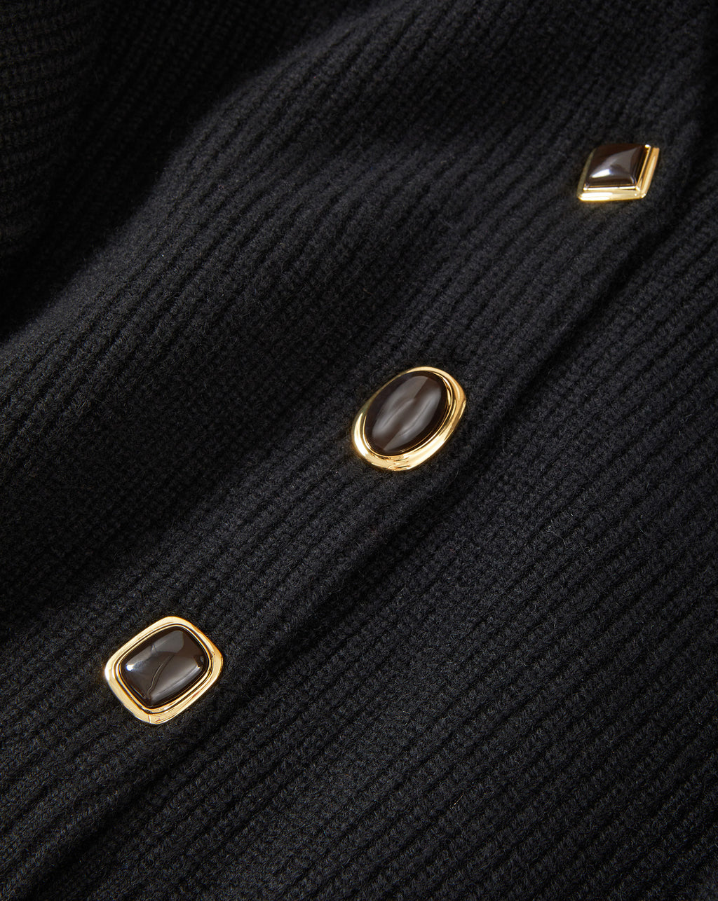 Veronica Beard Black ribbed cardigan with gold-rimmed buttons.
