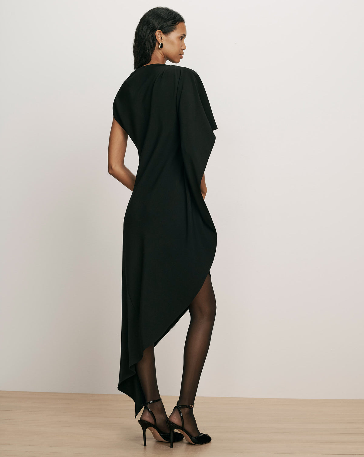 Veronica Beard Black asymmetric dress with draped high-low hem.