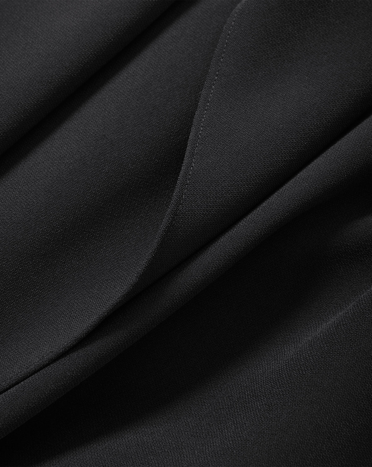 Veronica Beard Black textured fabric with stitched hem detail.